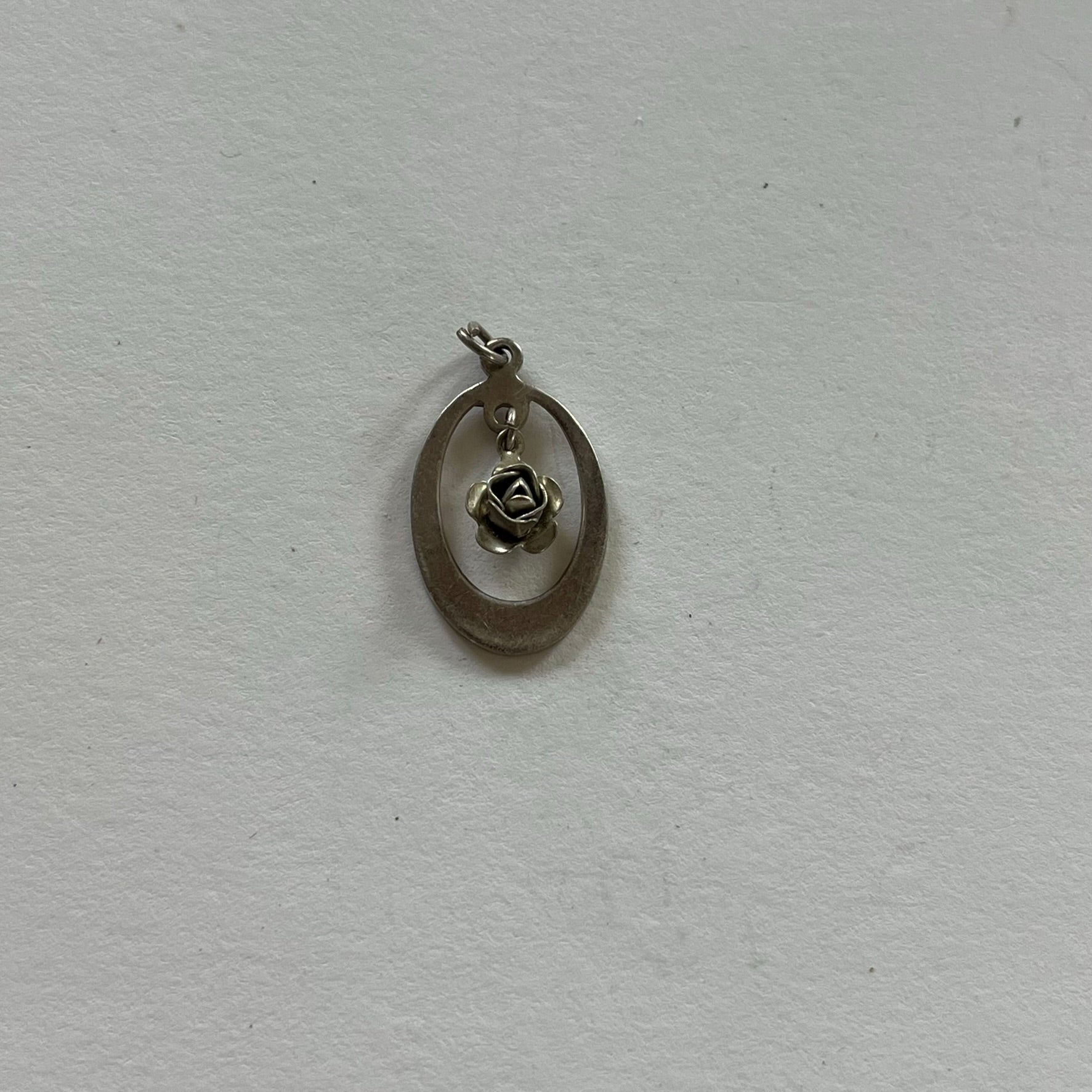 VINTAGE STERLING SILVER CUTOUT ROSE PENDANT