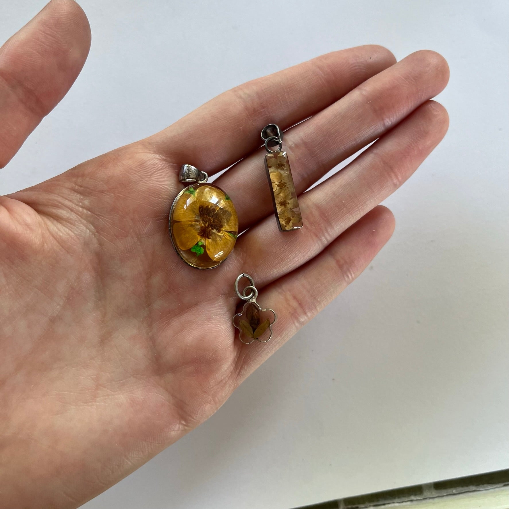 VINTAGE STERLING SILVER FLORAL RESIN PENDANTS
